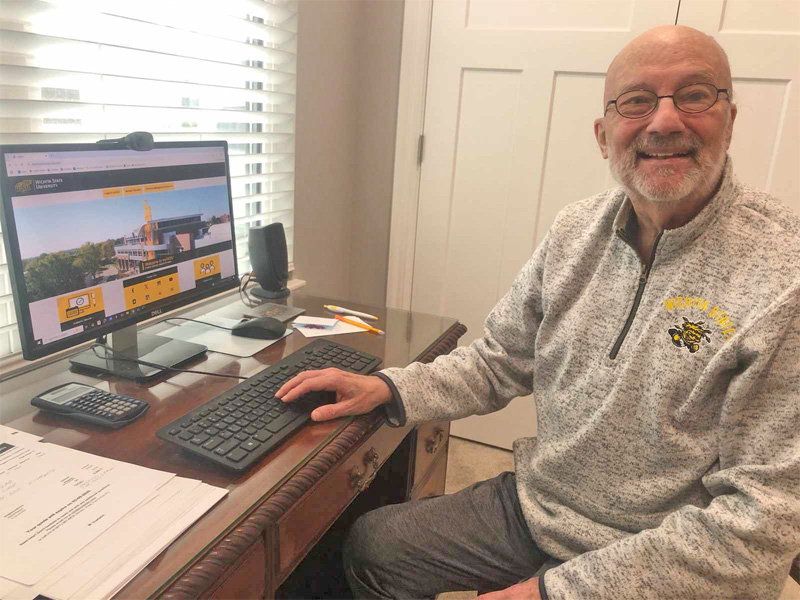 Arland Wallace works at his computer