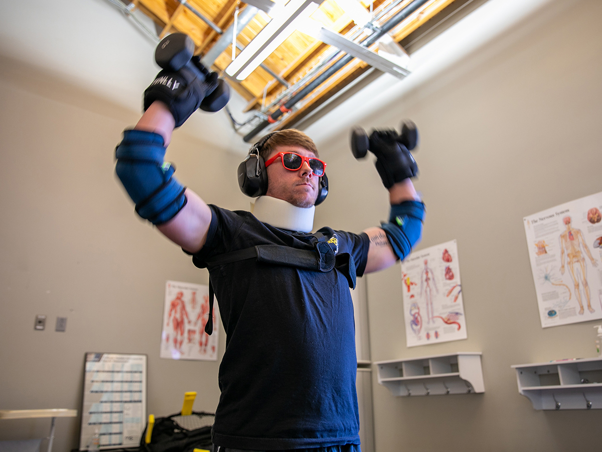 Adam Rutherford wears a geriatric-simulation suit