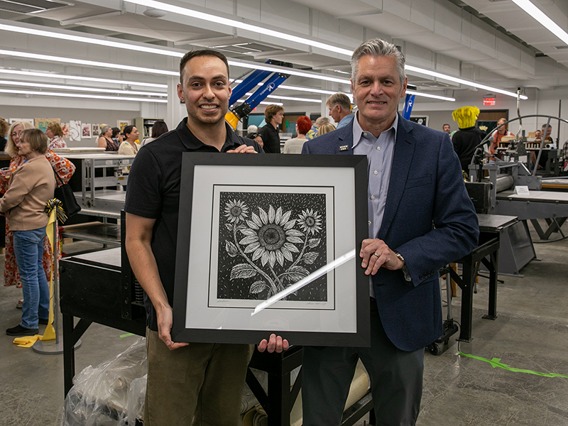 Marco Hernandez (left) stands with President Muma