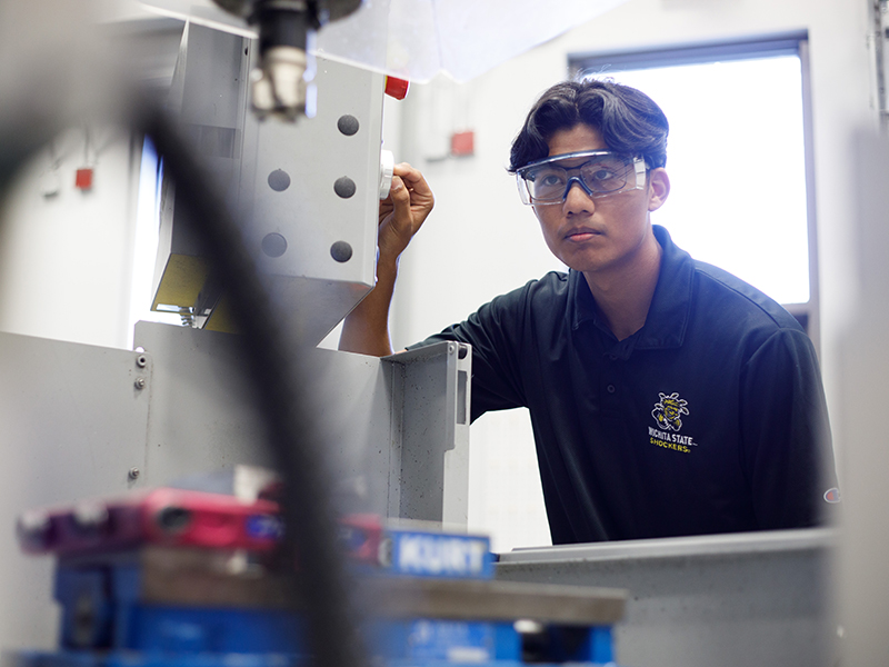 A Wichita State student conducts research