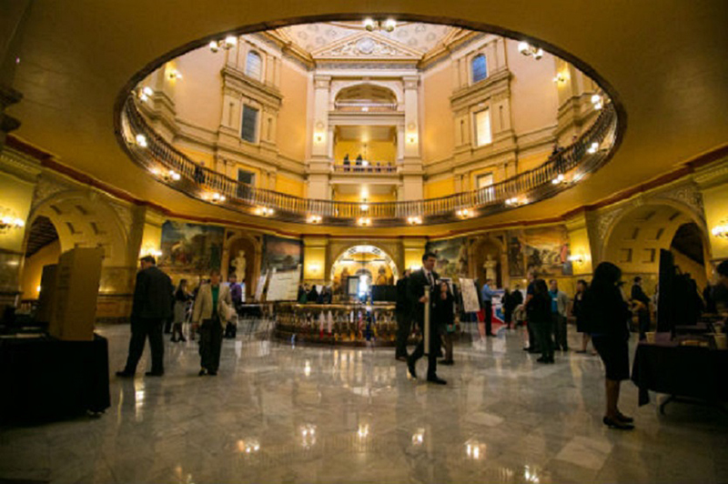 Graduate students presenting in capitol rotunda