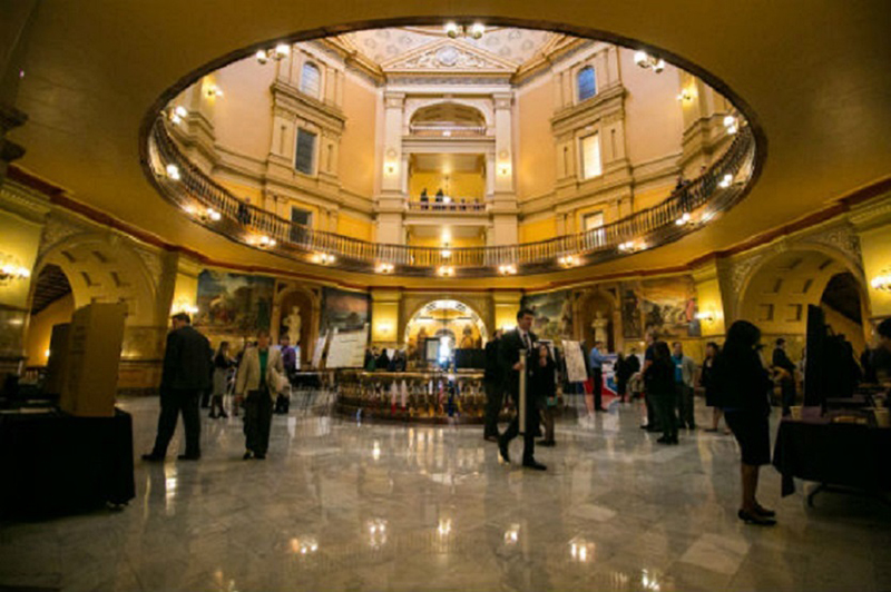 Photo of the inside of the capitol building during an event. 