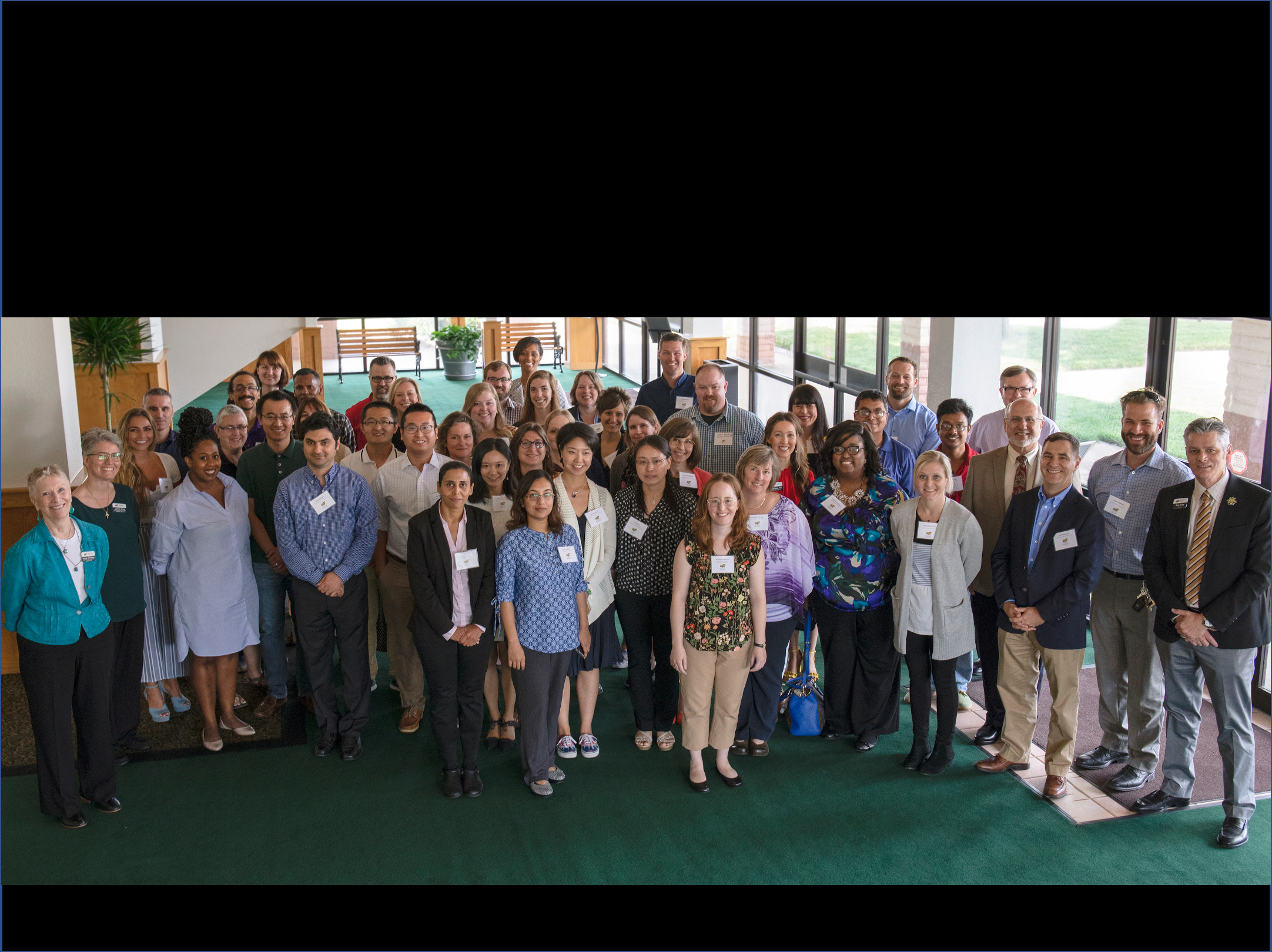 2019 photo of new faculty with now-President Rick Muma. 