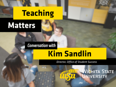 Students sitting in chairs talking in the student center