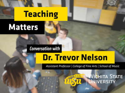 students sitting in chairs talking at the student center