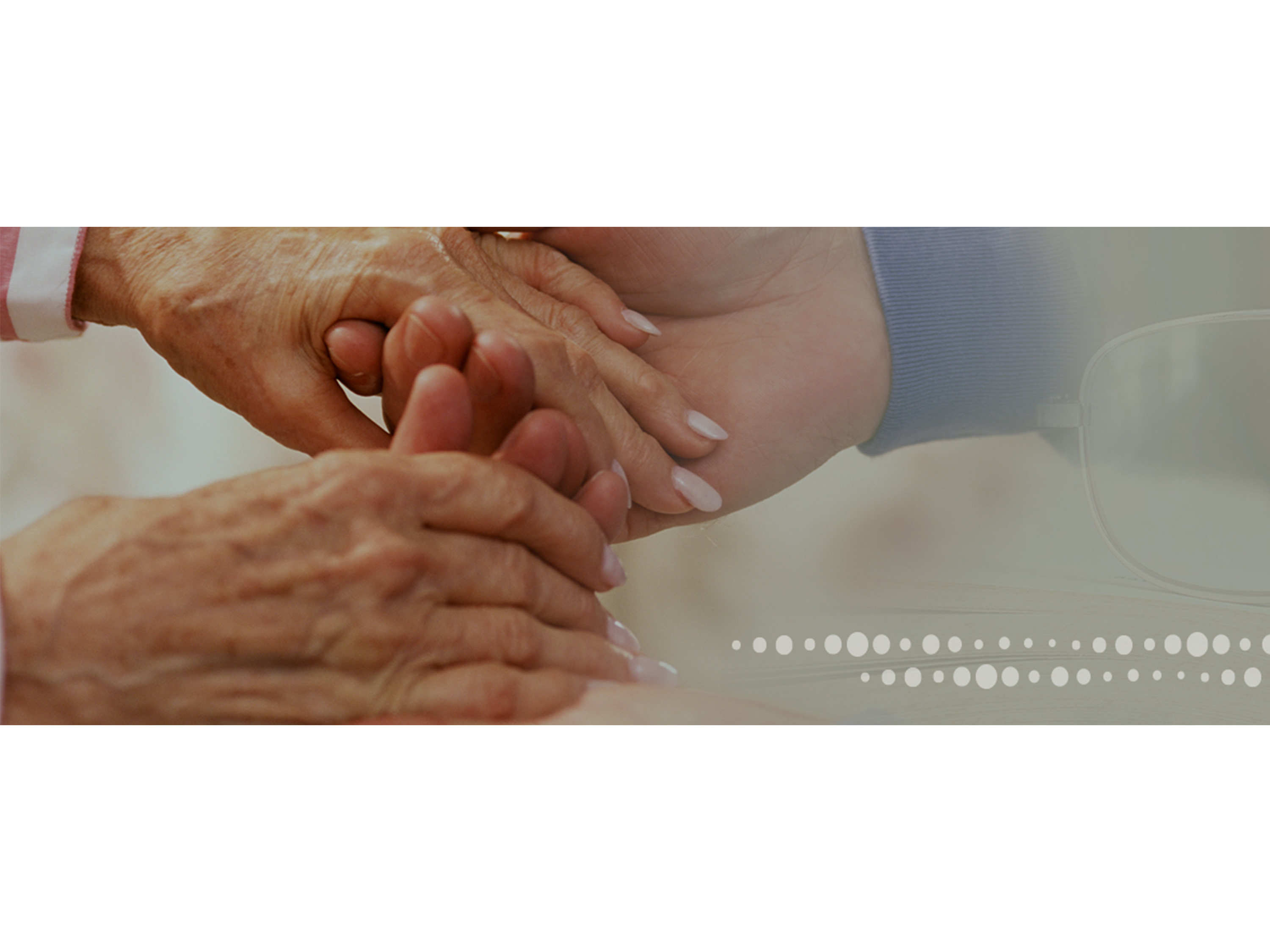 Close-up of hands held in another person's hands.