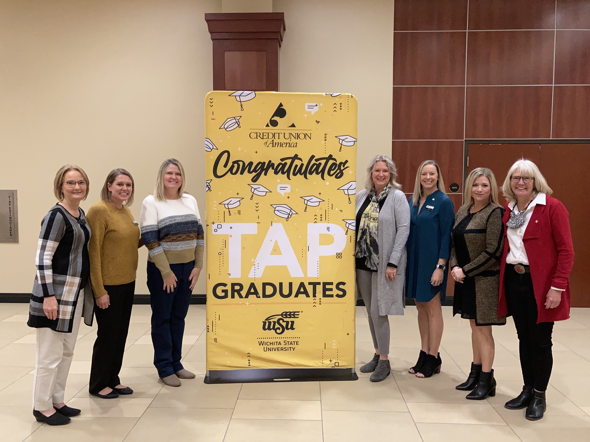 People smiling at the TAP graduation celebration