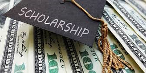 Photo of money and graduation cap Photo of money and graduation cap