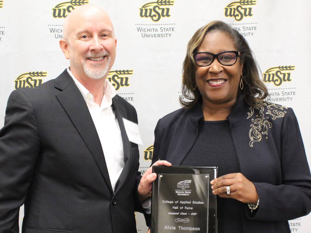 USD 259 Superintendent Alicia Thompson accepts her plaque