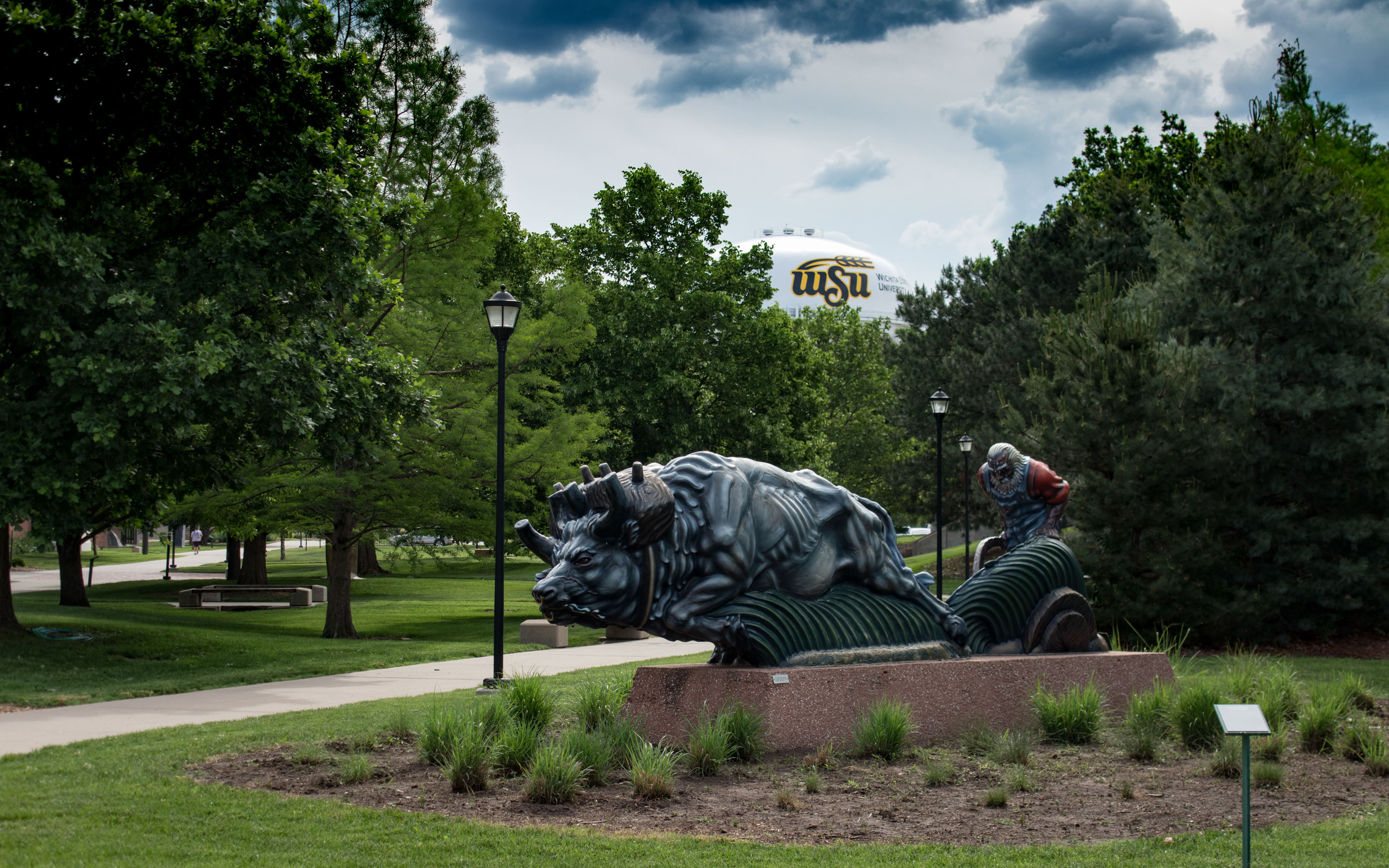 Statue on WSU campus, man plowing field with oxen