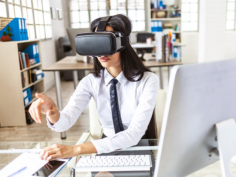A woman using a vr headset in a classroom