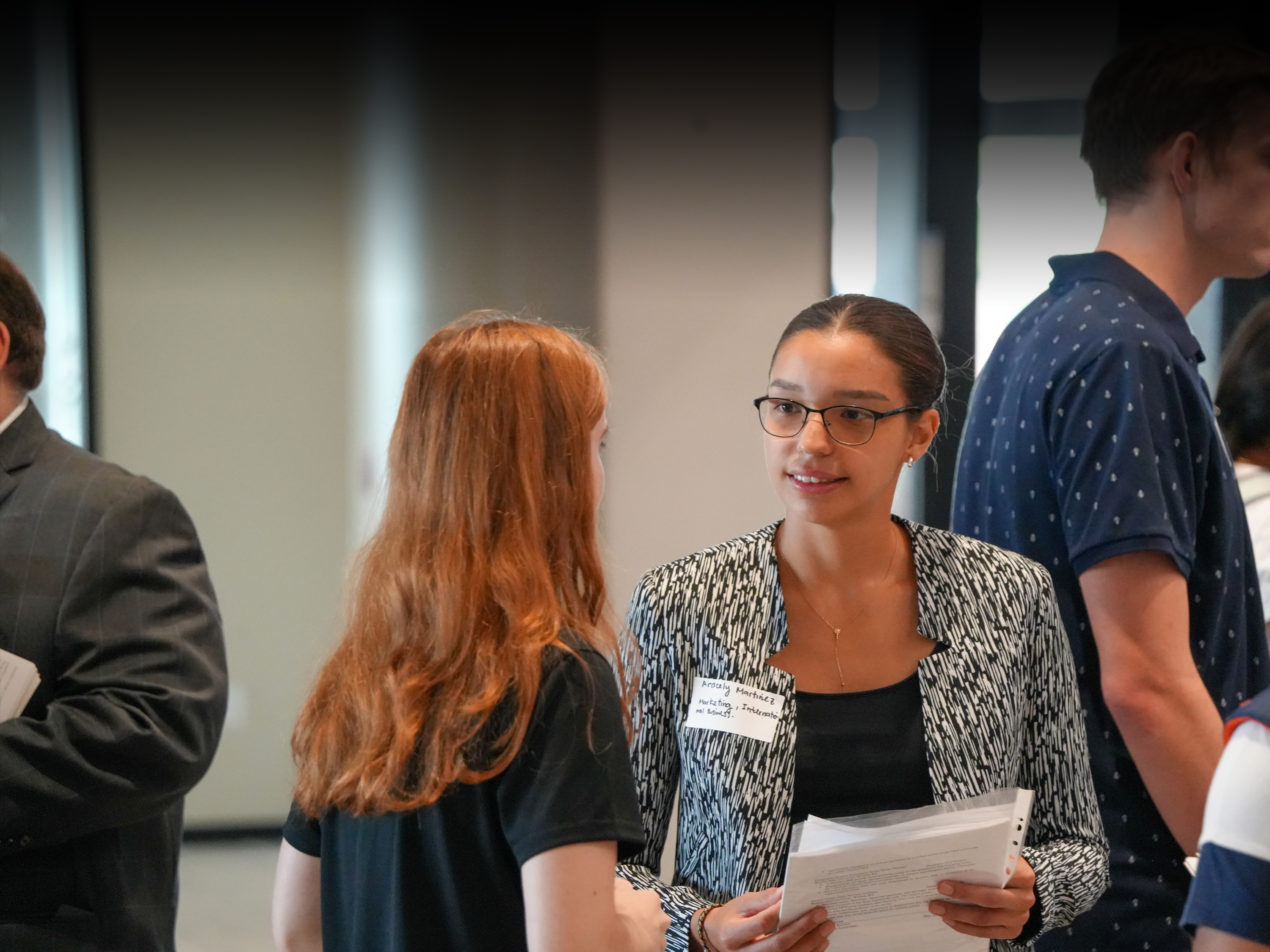 Marketing student having discussion in Woolsey Hall.