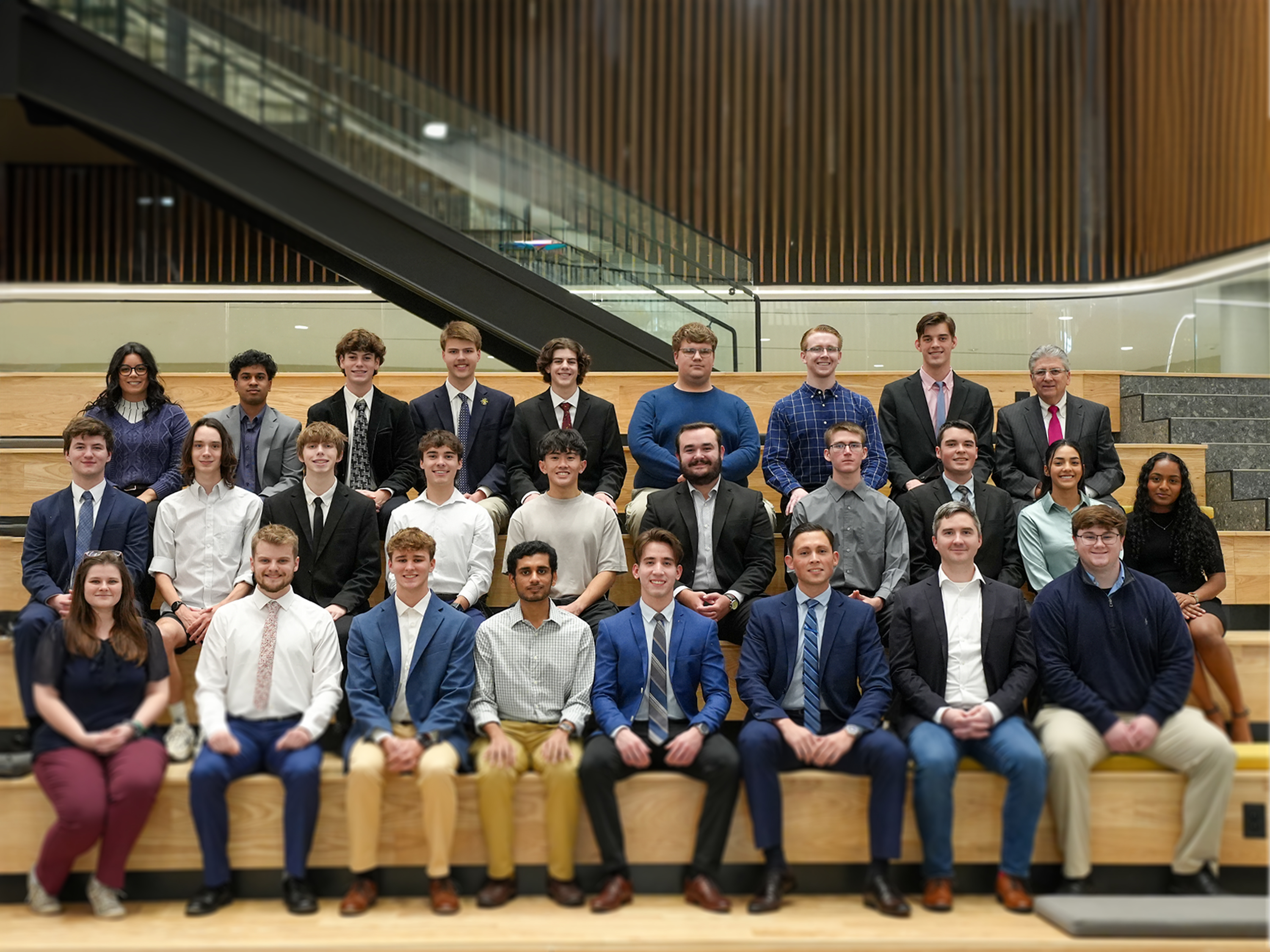 Student Managed Investment Fund group photo on the Social Stairs in Woolsey Hall.