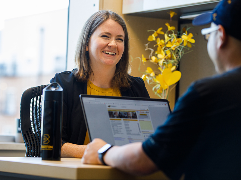 A student meets with an academic advisor in Woolsey Hall