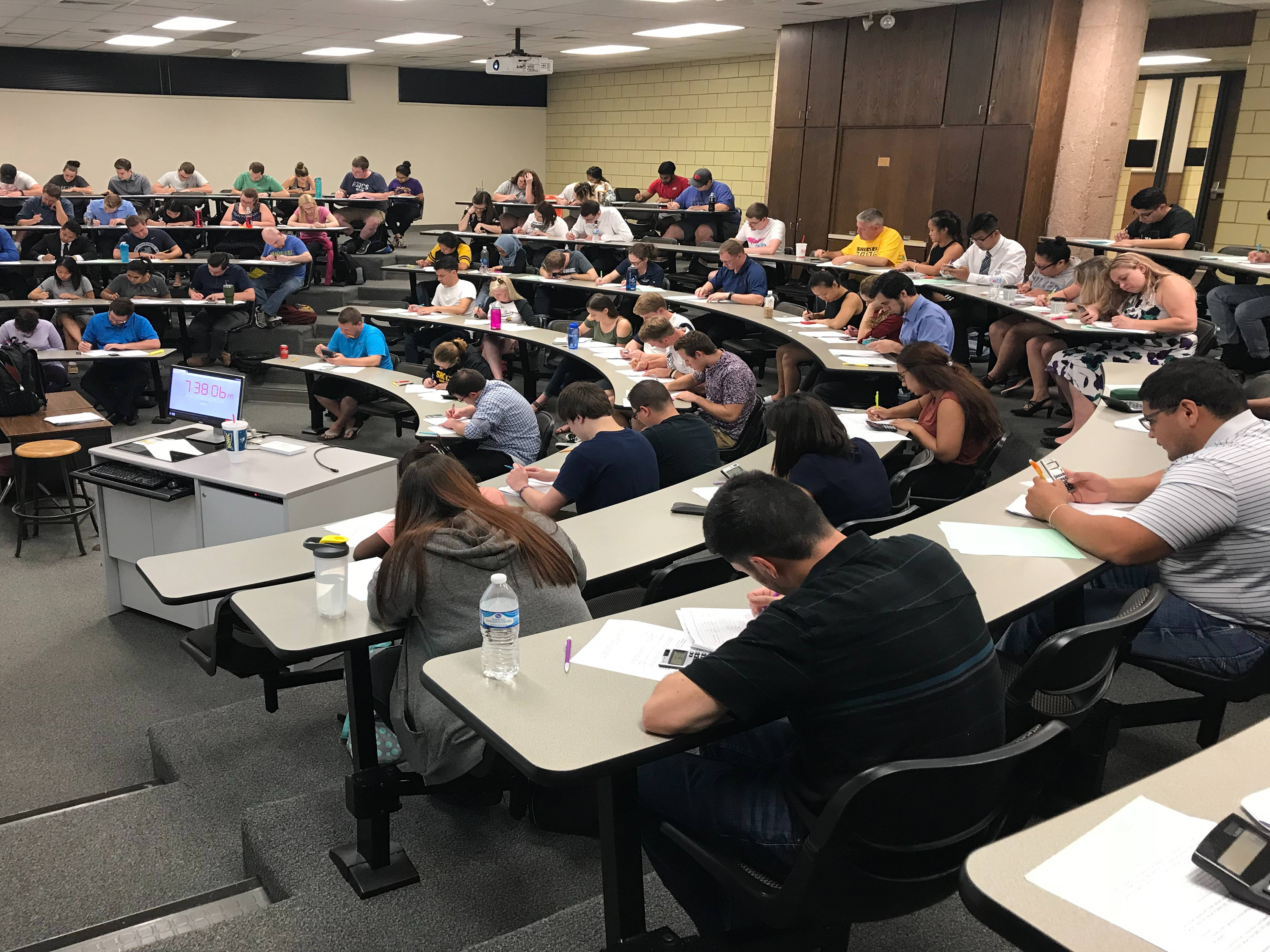 Students complete an assignment in a Barton School lecture hall classroom