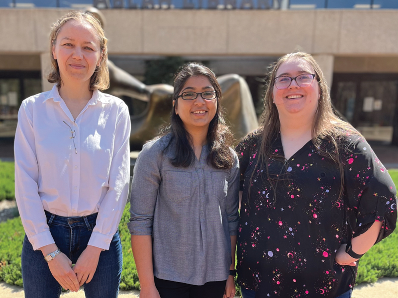 Brittany Wojciechowski, Amulya Lomte, and Maria Jose Carrillo Munoz posed together in front of Ablah Library.