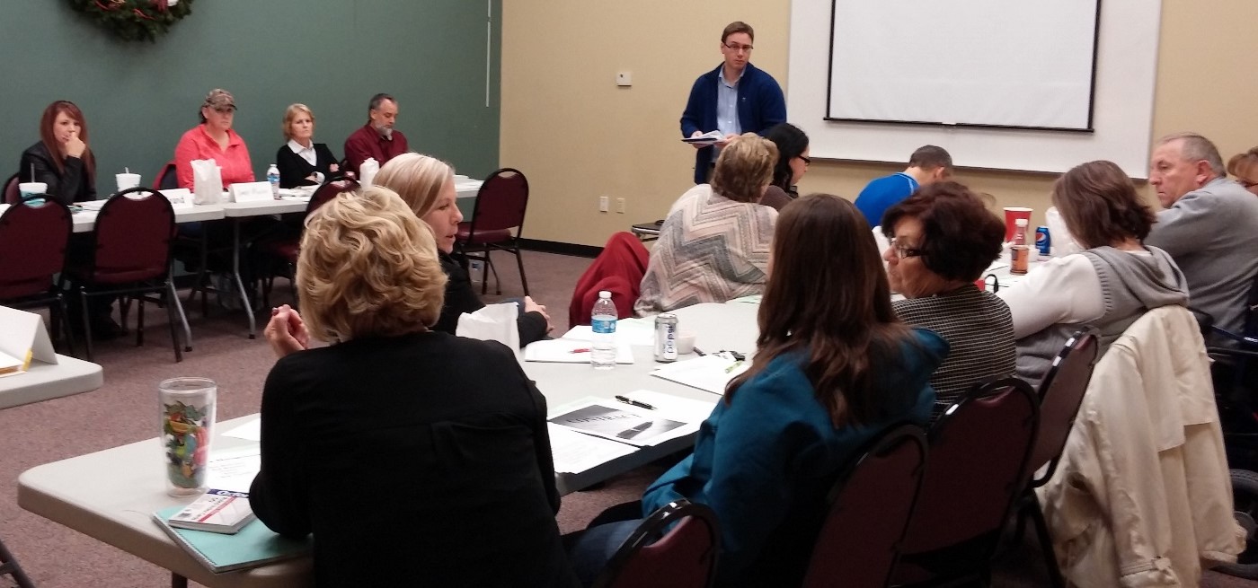 Garnett participants of the Growing Rural Businesses Training sitting istening to a trainer.