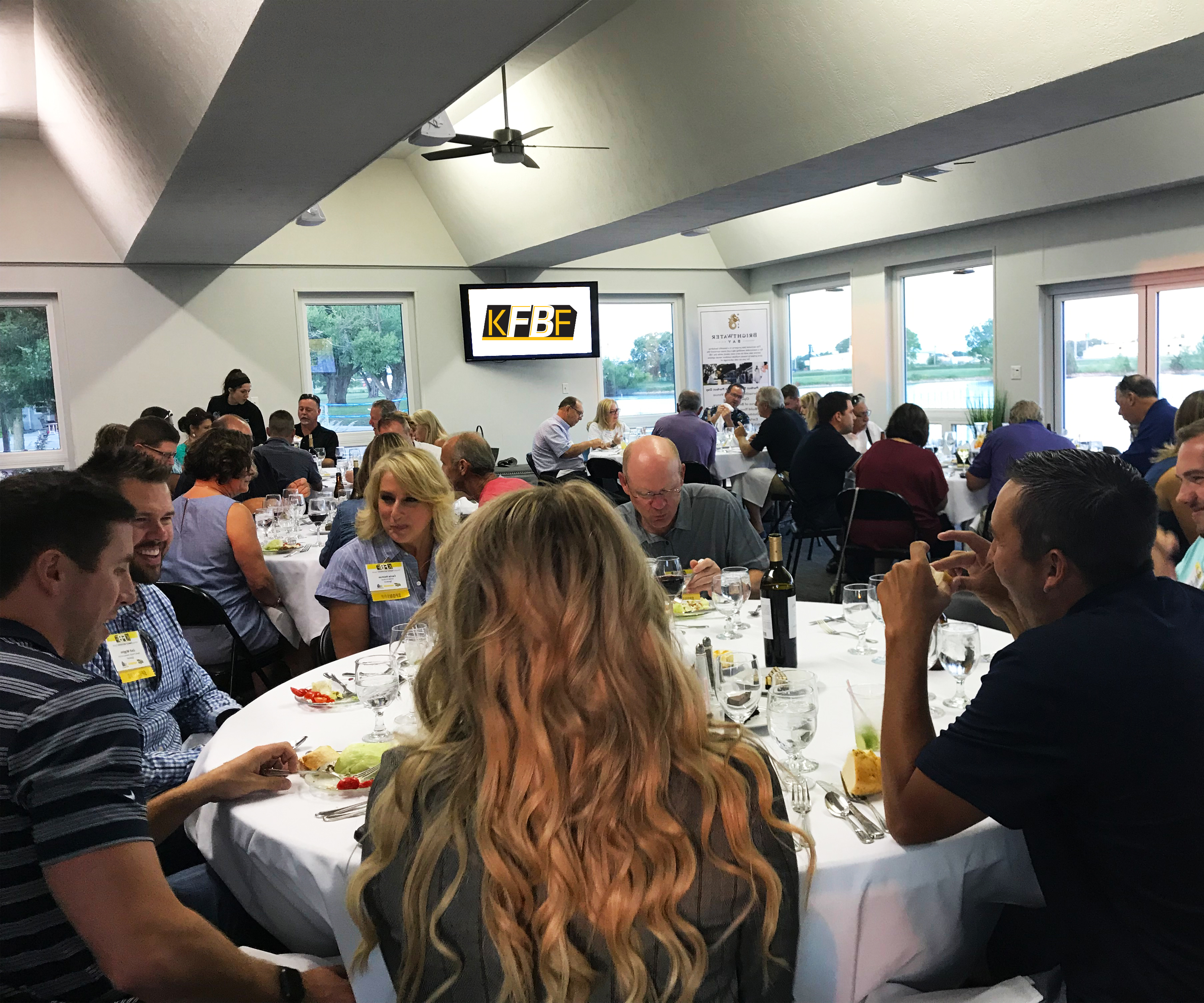 Kansas Family Business Forum members eating dinner and laughing