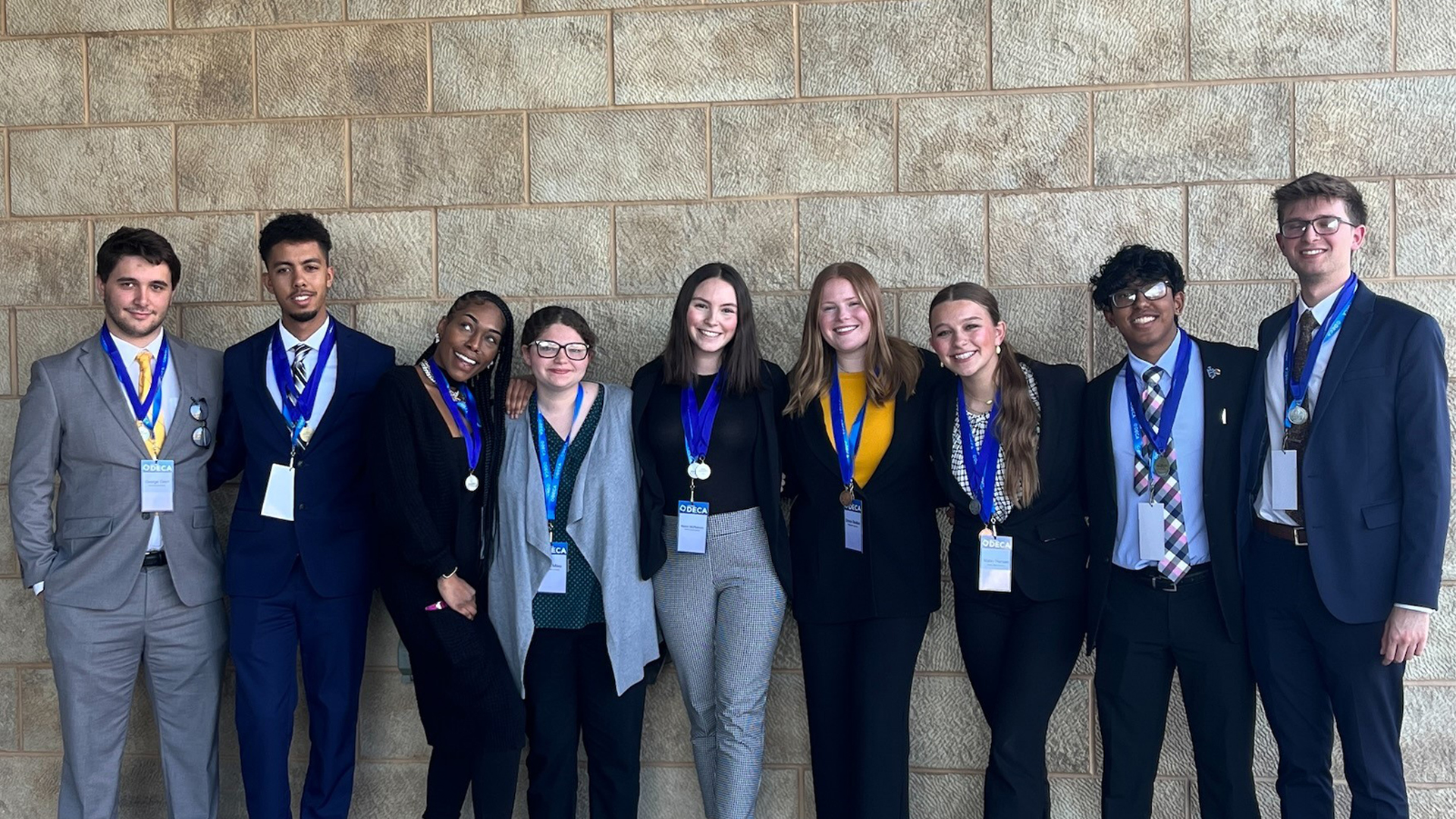 Collegiate DECA chapter at Wichita State University members George Giem, Tayshaun Washington, Valishia Landrum, Nivea, Raven McPherson, Grace Skelton, Maley Hansen, Ronish Rasaily, and Nathan Holloway