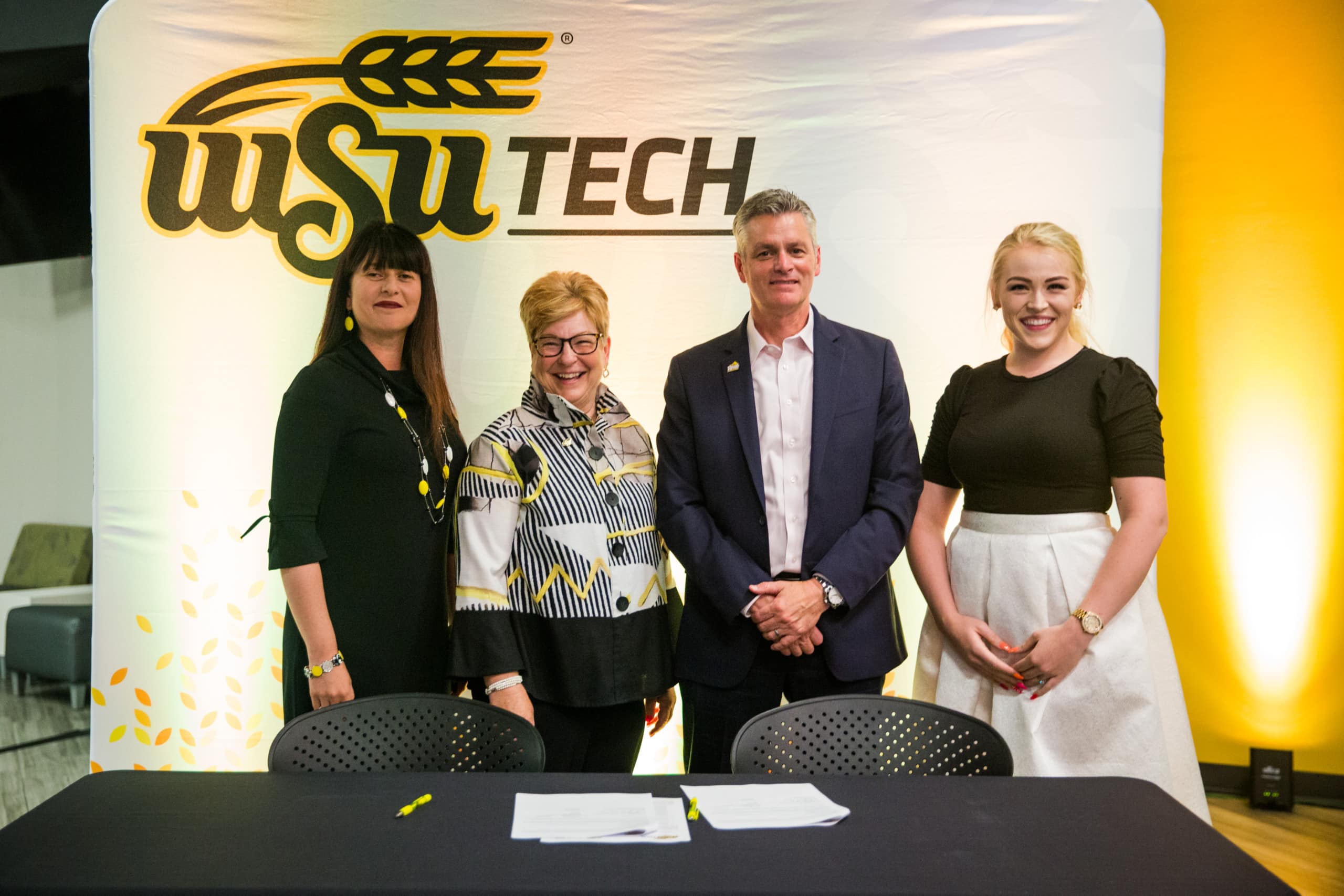 Dr. Larisa Genin, dean of the Barton School of Business, Dr. Sheree Utash, President of WSU Tech, Dr. Rick Muma, President of Wichita State University and Hope Amor, WSU Barton School of Business Student, WSU Tech Graduate and 2021 Scholarship Recipient.