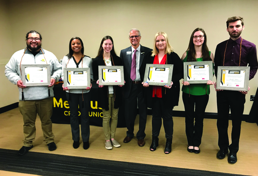 Students are presented with certificates and ropes following completion of the Professional Edge program.