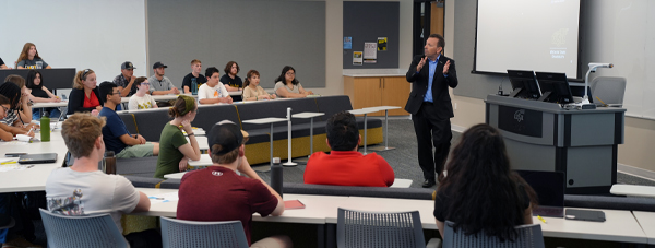 Students listen to a guest speaker during a Professional Edge session.