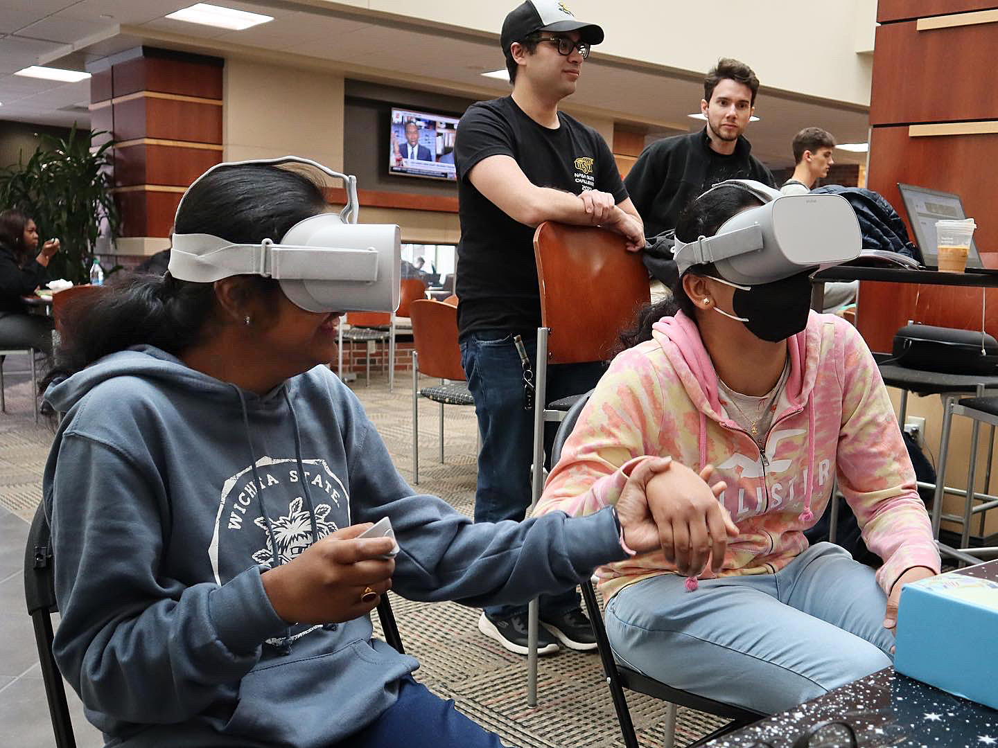 Collaborative XR Development course image of two people with headsets on playing a game