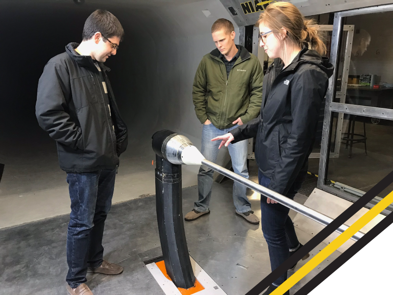 Hassan Farhoud and Mark Elliott are learning from classmate, Maggie Koops, in the Beech Windtunnel