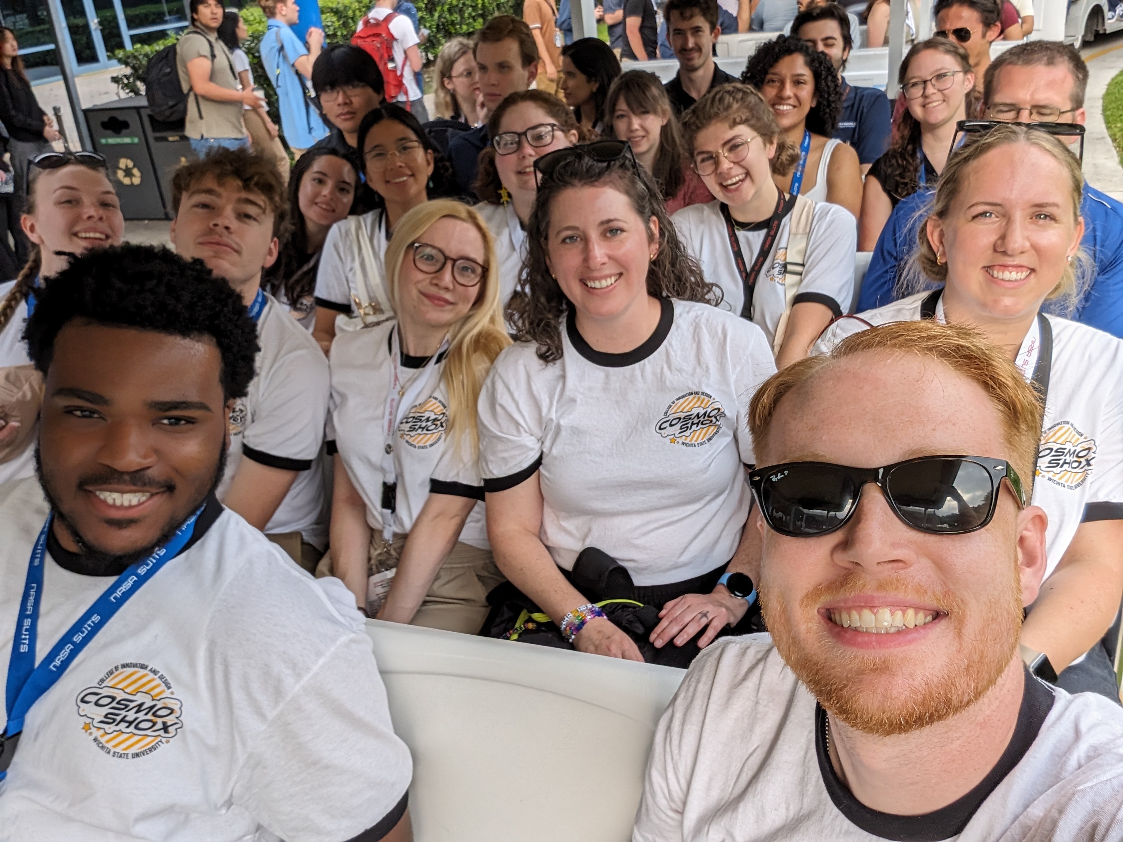A group of students posing for a group photo on tour at Johnson Space Center