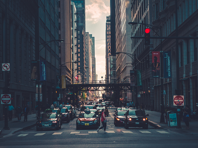 Woman crossing the street in a big city