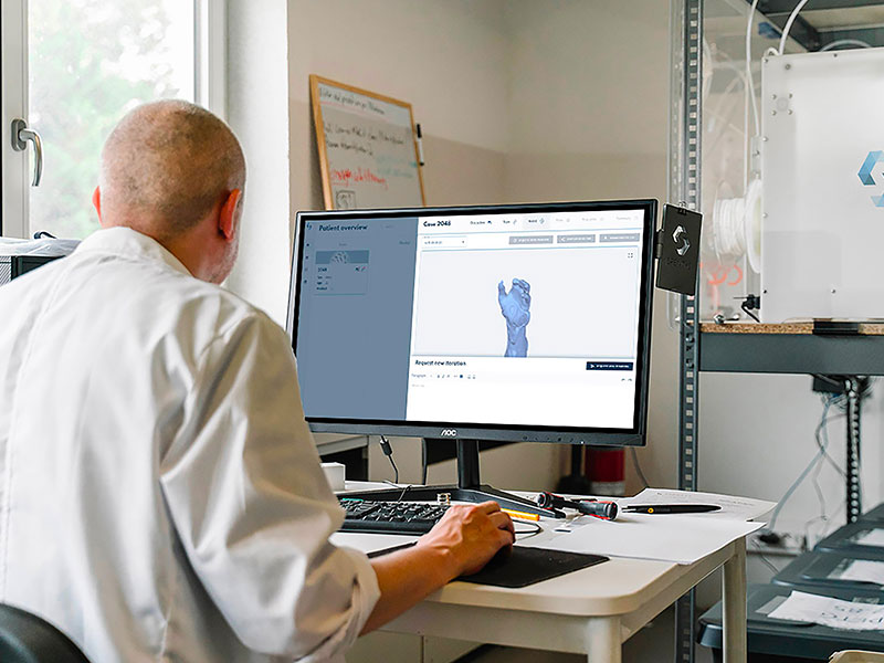 Man using modeling software to create a hand