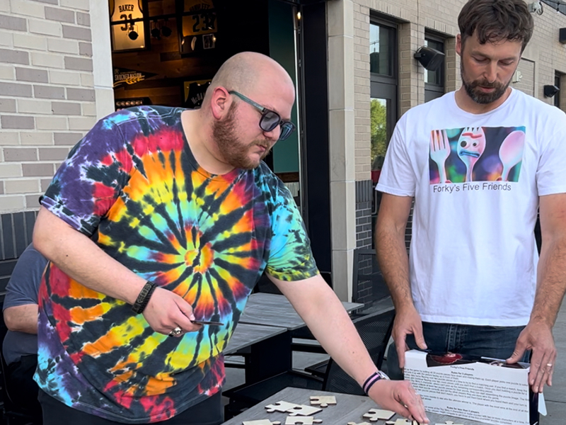 Eli Page and Andrew Steed demonstrating Puzzle game