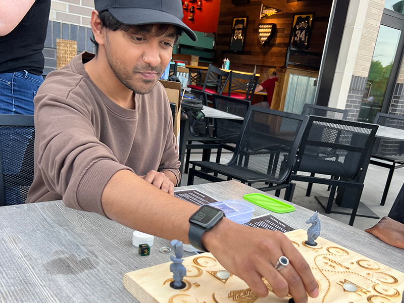 Gautham playing his hand crafted game