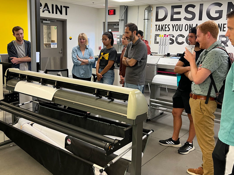 MID students at GoCreate, training on the printer