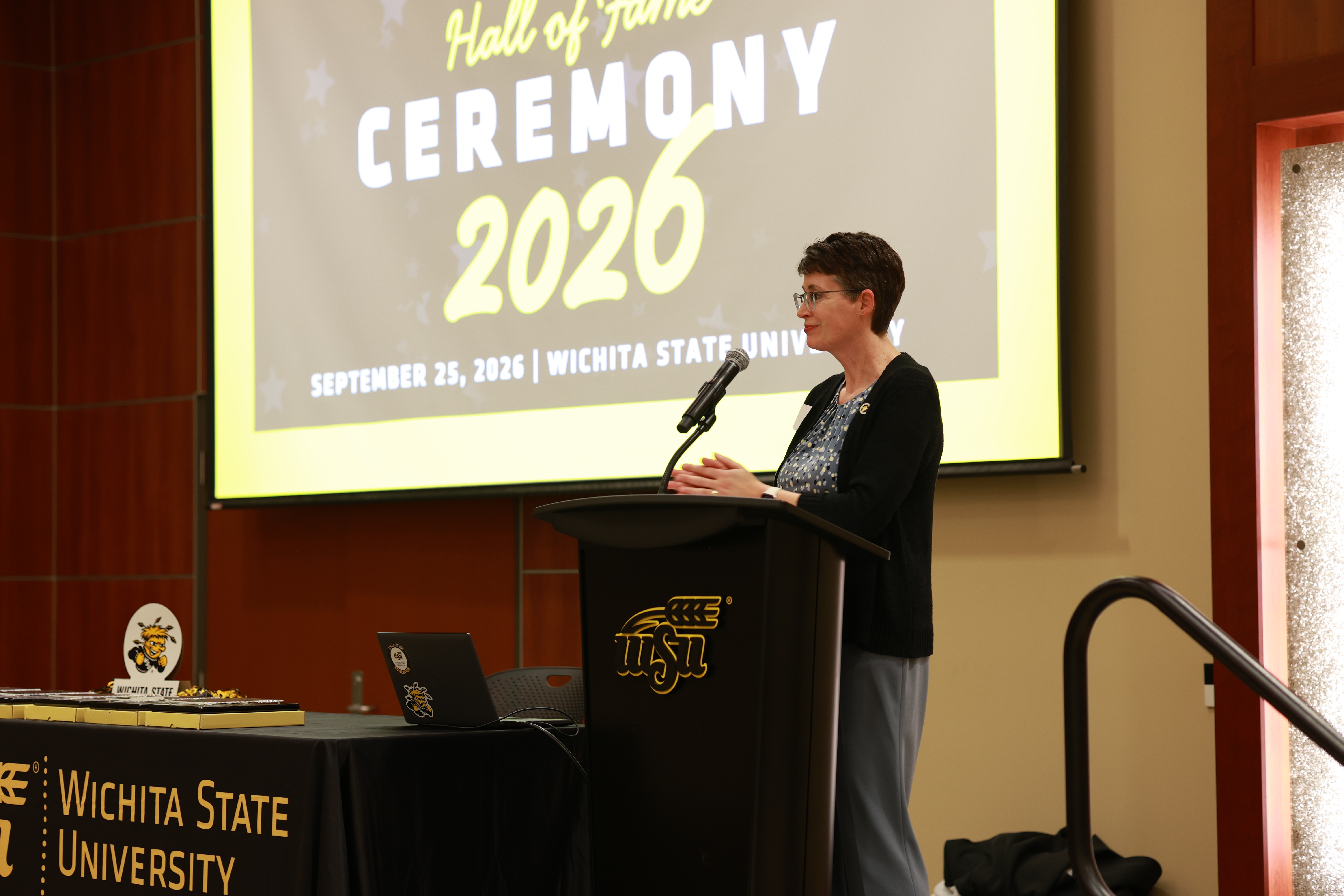 College of Education Dean, Dr. Jennifer Friend, speaks at the podium during the 2026 College of Education Hall of Fame Ceremony