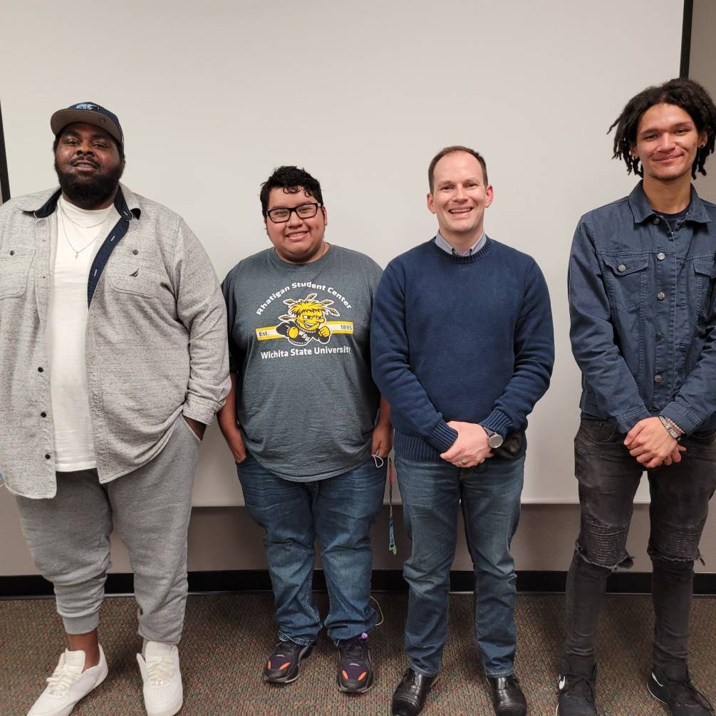 Mayor Brandon Whipple standing with students