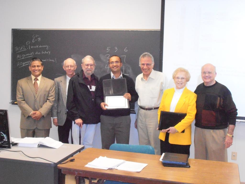 Dr. Namboodiri receiving the WSU Excellence in Teaching Award.