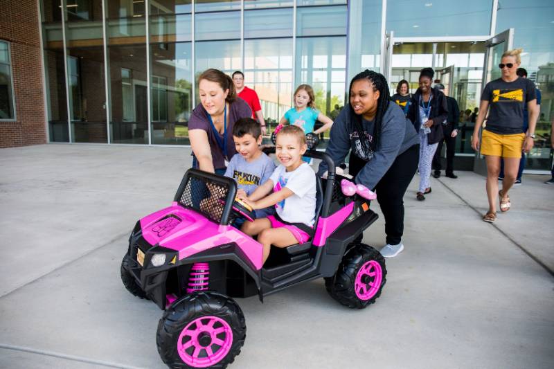 Girl Riding in Go Baby Go Car