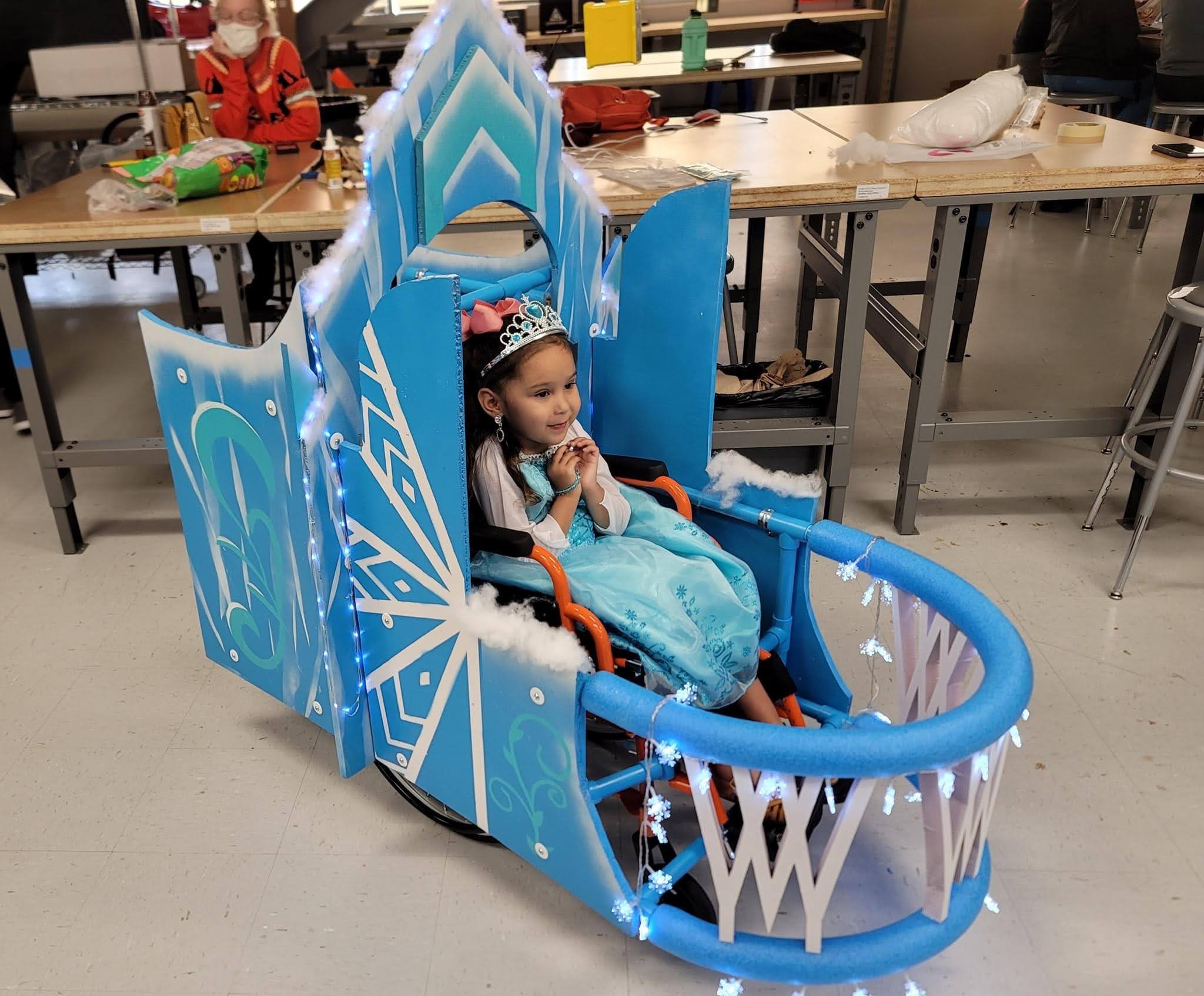 Little girl in a wheelchair costume for Halloween.