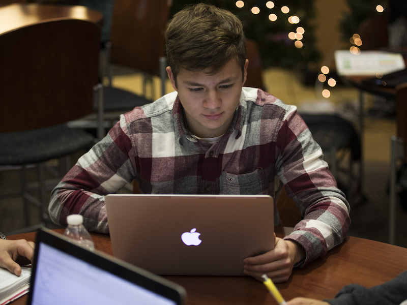 Engineering student reading the Weekly Newsflash