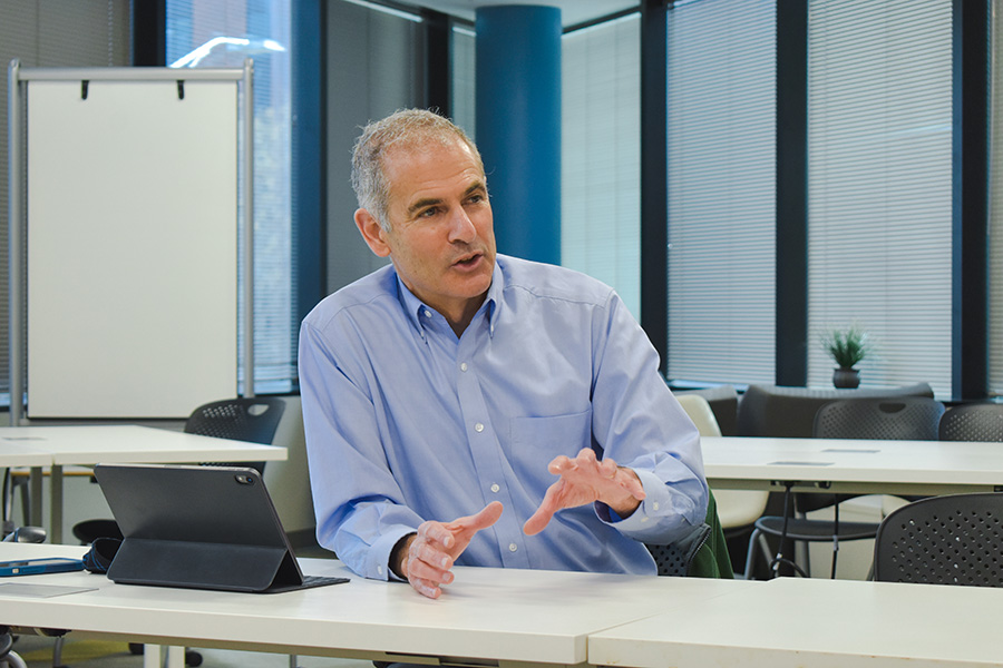 Dean Muscat sitting and talking