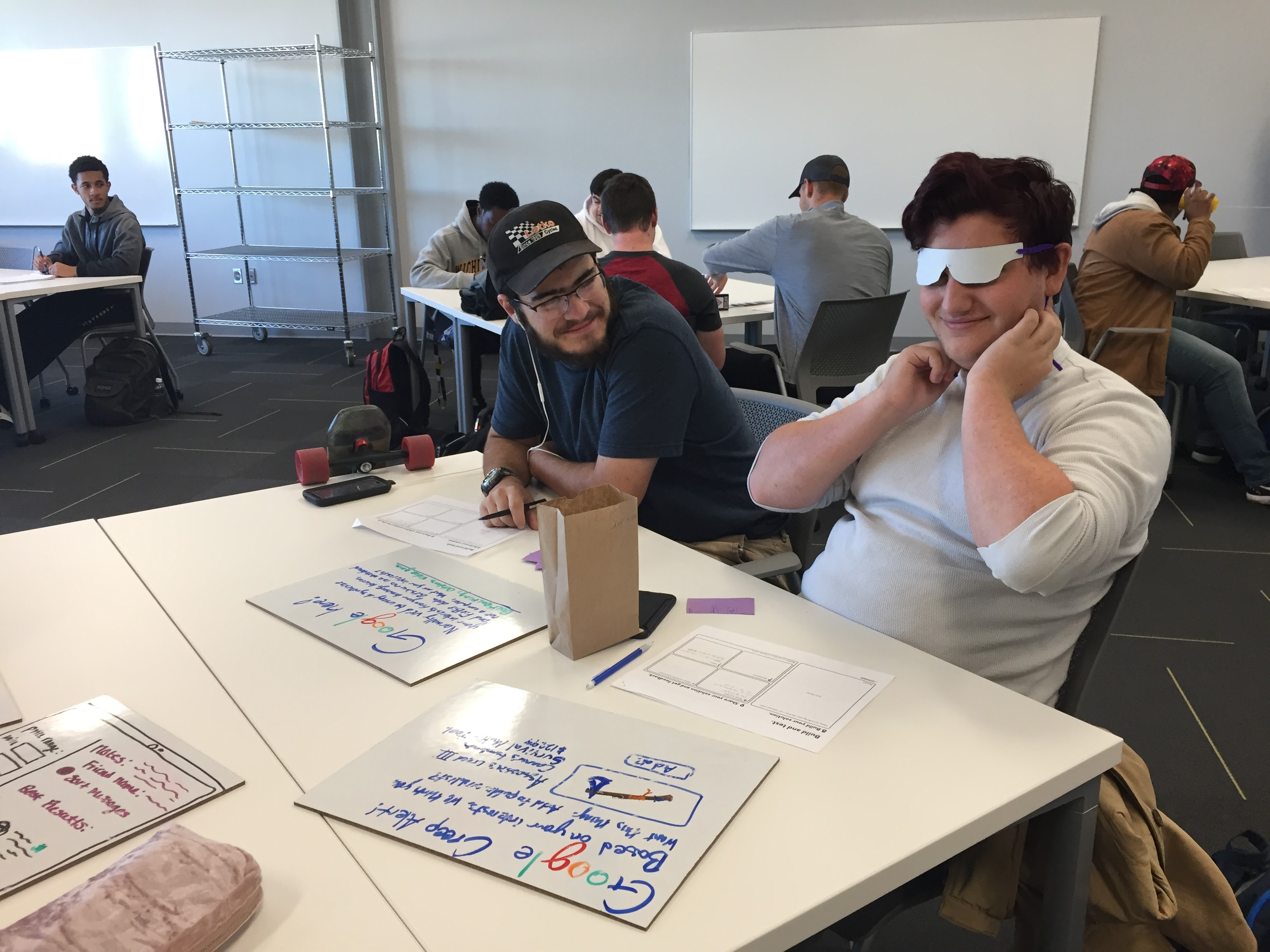 Two students trying out prototypes.