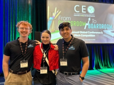 Three students at a conference.