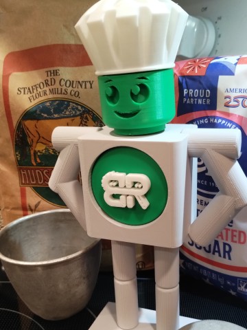 Byte to Bite mascot with chefs hat and baking ingredients