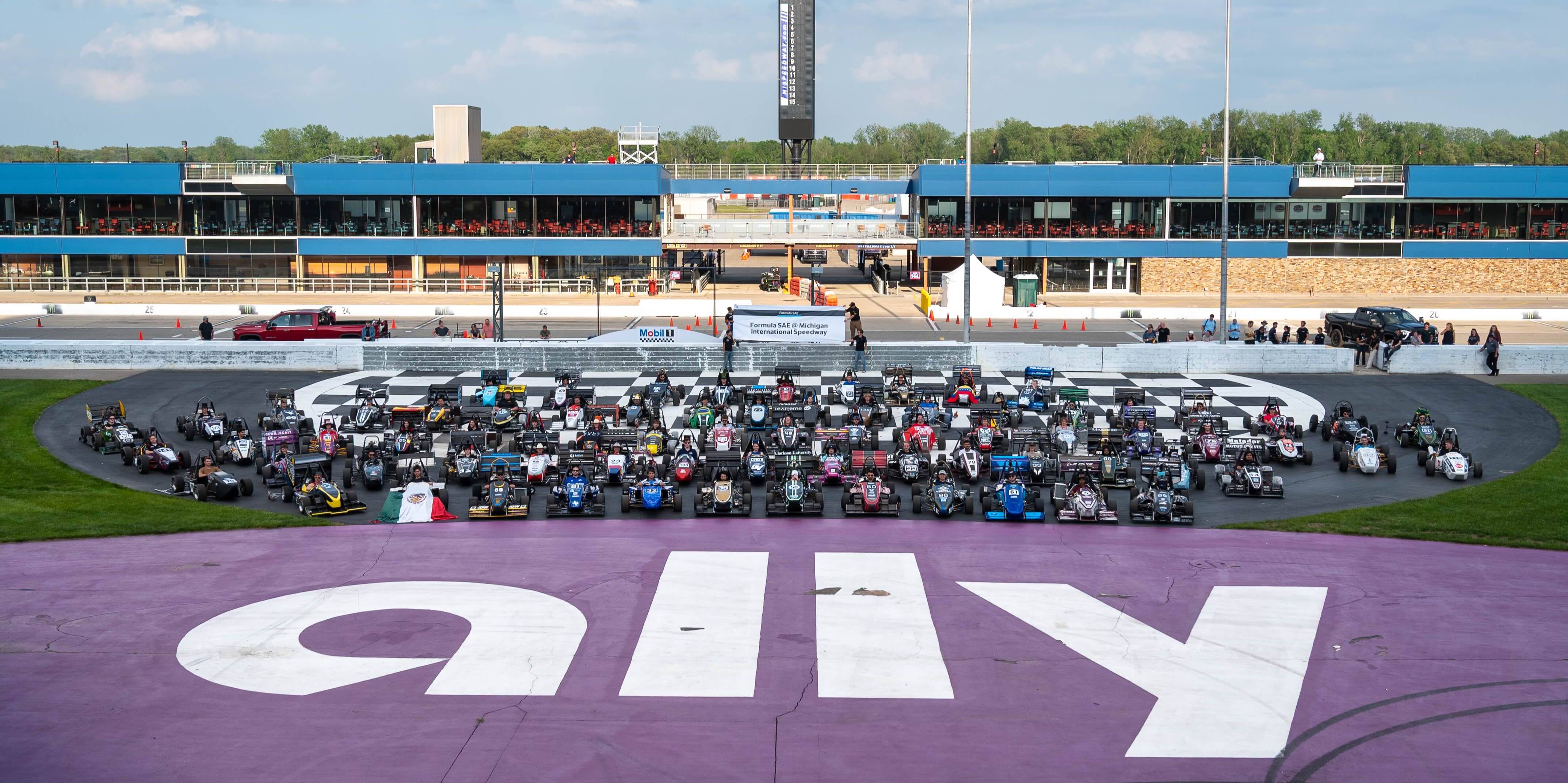 Group photo of cars at Formula SAE IC Michigan