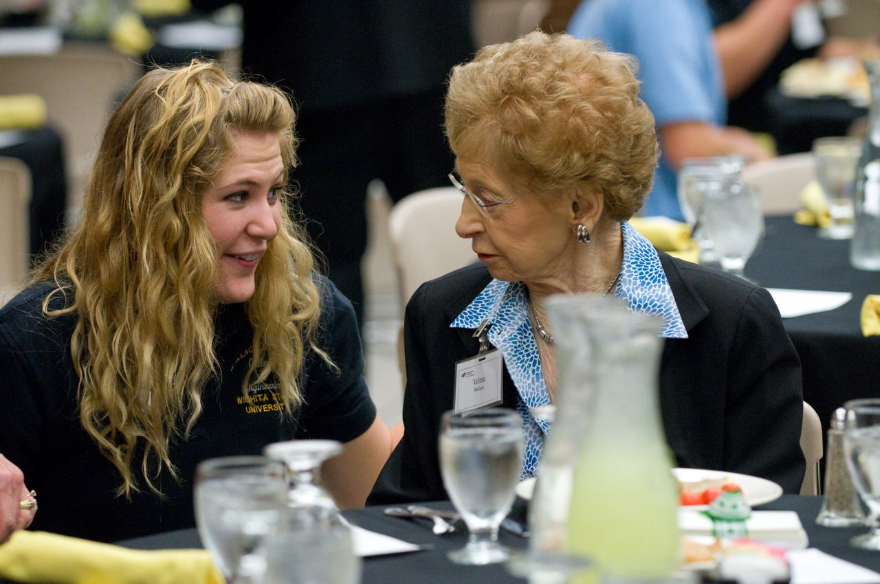 The late Velma Wallace talks with Wallace scholarship recipient (and now alumna) Allison Ronning.