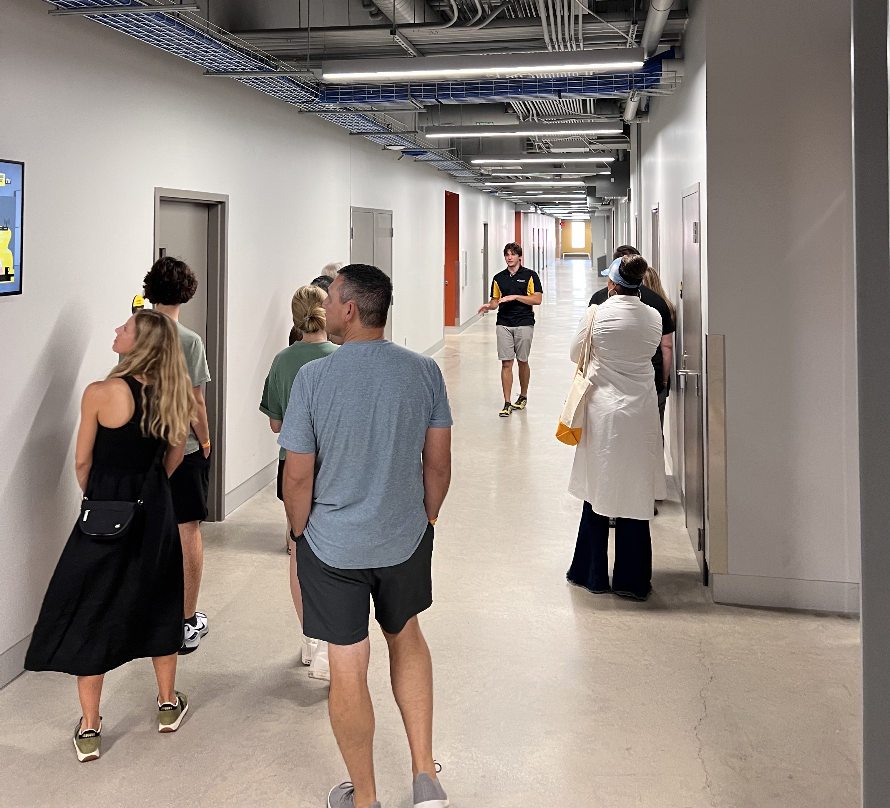 Trent Oberlander is pictured giving a tour to some prospective students and their families.
