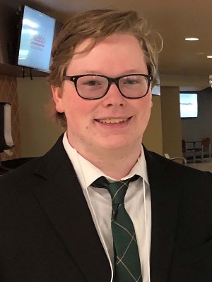 young man in suit smiling
