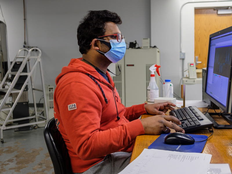 Graduate student using NMR
