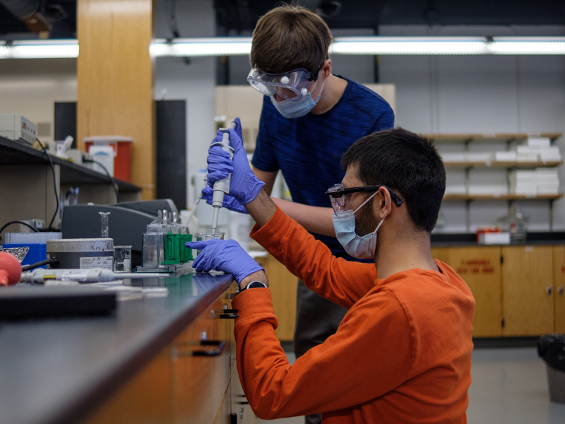 student pipetting